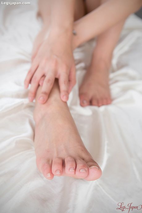 Big titted Asian teen Rin Miura strips and shows her hairy pussy