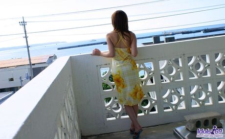 Hot Asian cougar Yua Aida strips and flaunts her sexy butt and tits