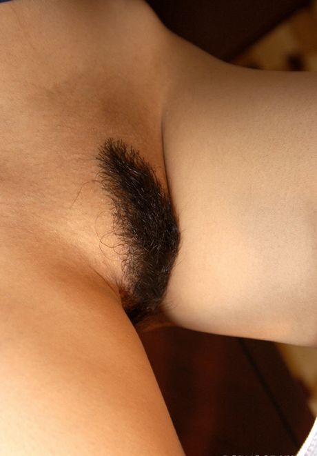 Crazy Asian slut exposes her fine hairy pussy and her firm sexy titties for fun