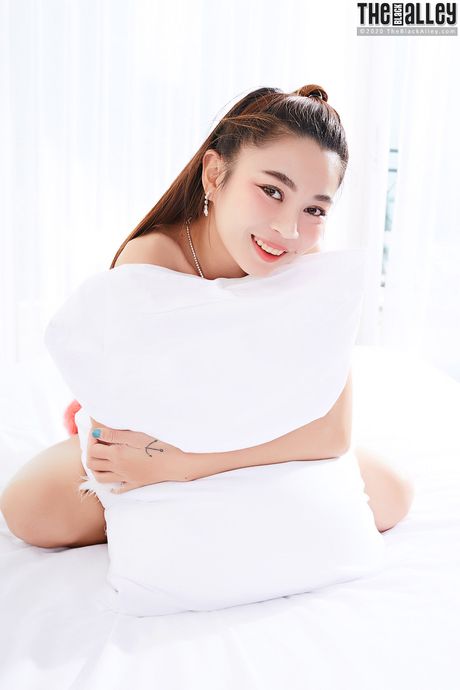 Asian teen Juliet shows her hairy pussy and toys it with a dildo