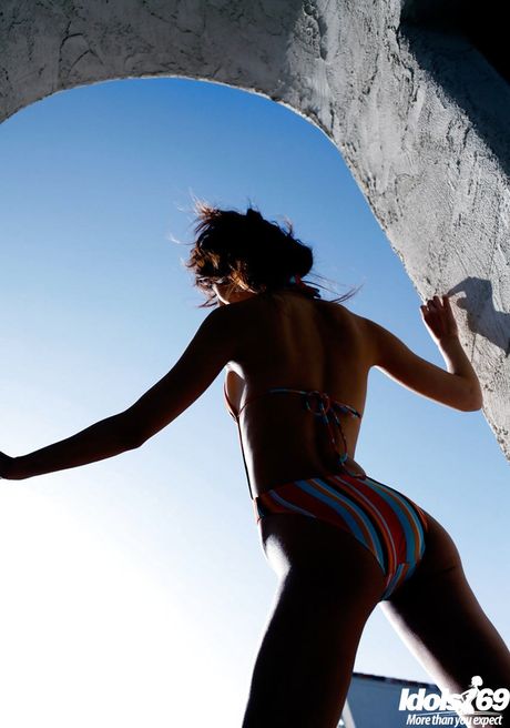 Sylphlike japanese young Yu Satome bares her butt outside